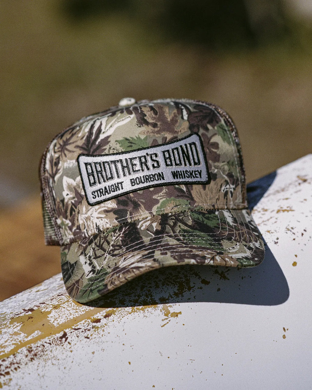 Camo Wordmark Trucker Hat